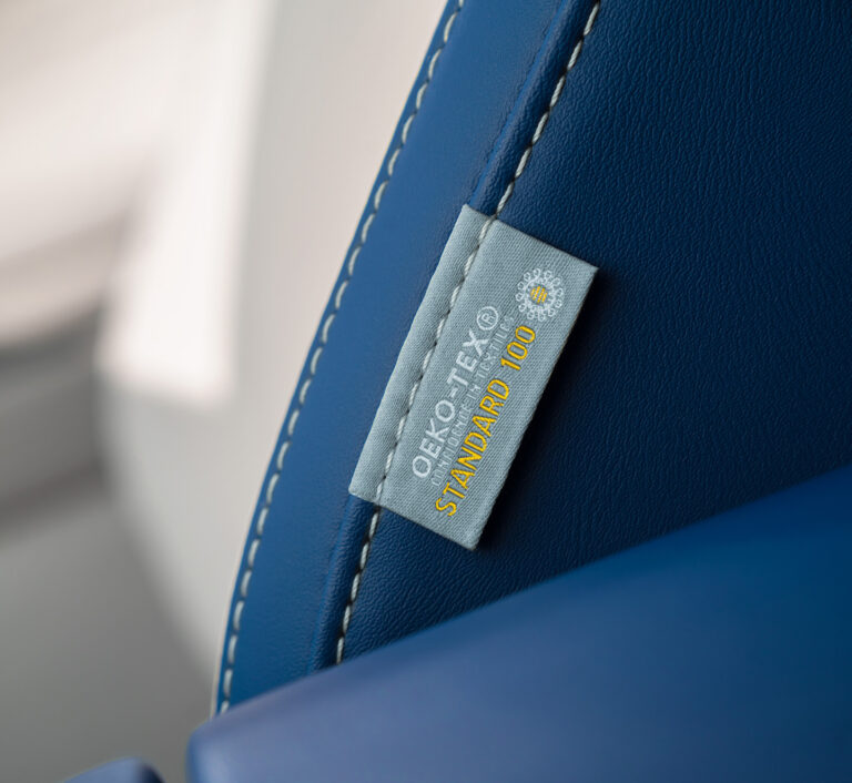 OEKO-TEX tag on vegan leather seat of Voyah Free — eco-friendly and safe materials.