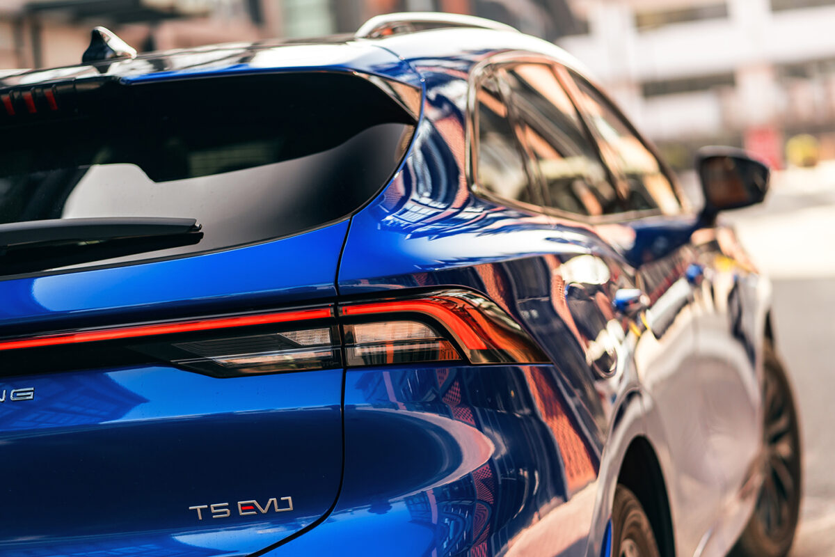 Fragment of the rear part of blue Forthing T5 EVO with expressive LED lights