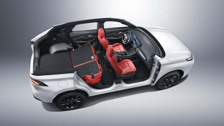 T5 EVO car interior with folded rear seats and red leather upholstery