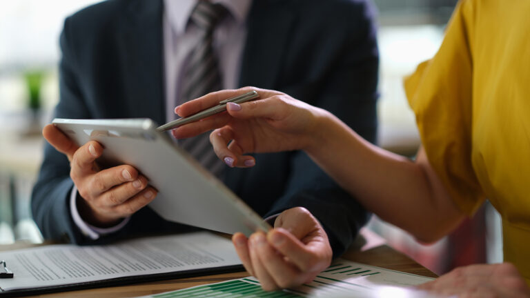Car insurance consultation using tablet in office